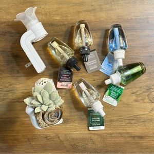 Lot of 5 Bath and Bodyworks wallflower refills NEW. 2 plug ins USED.